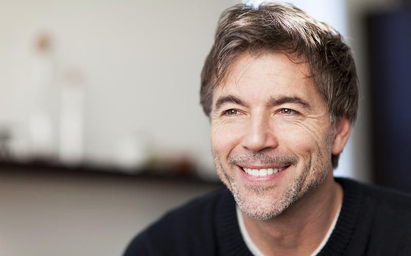 Mature Man Smiling And Looking Away